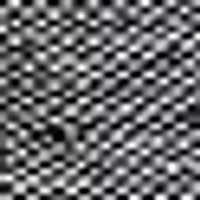 Mottled black and white blur, resembling a soft, textured checkerboard pattern.