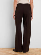 Dark brown wide-leg pants on model, back view. Smooth fabric.