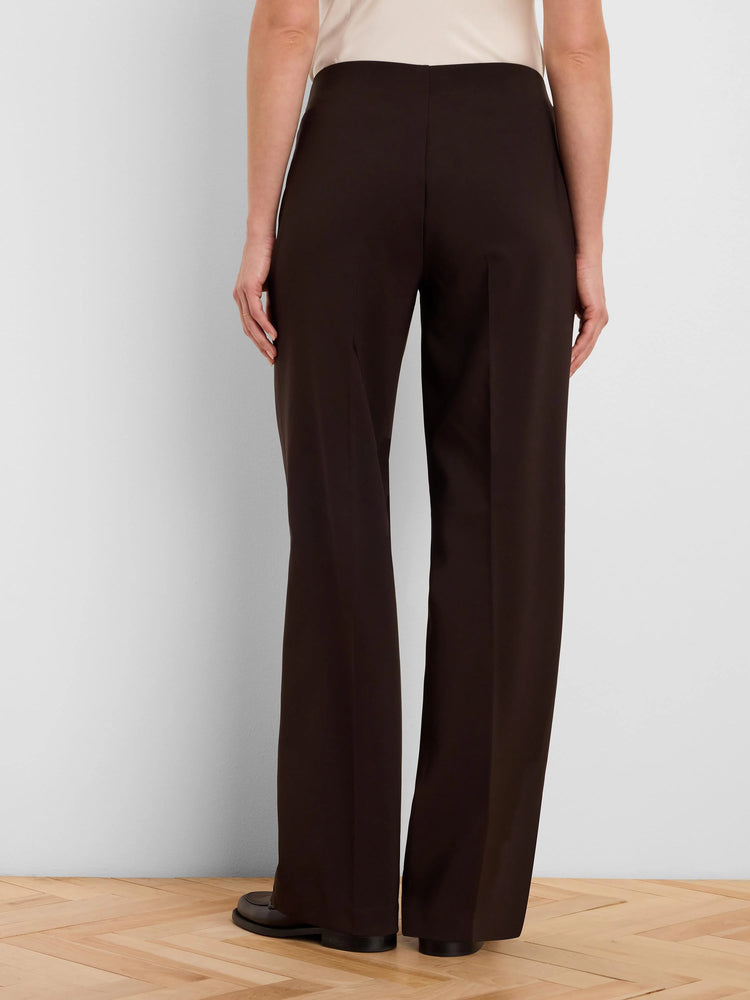 Dark brown wide-leg pants on model, back view. Smooth fabric.