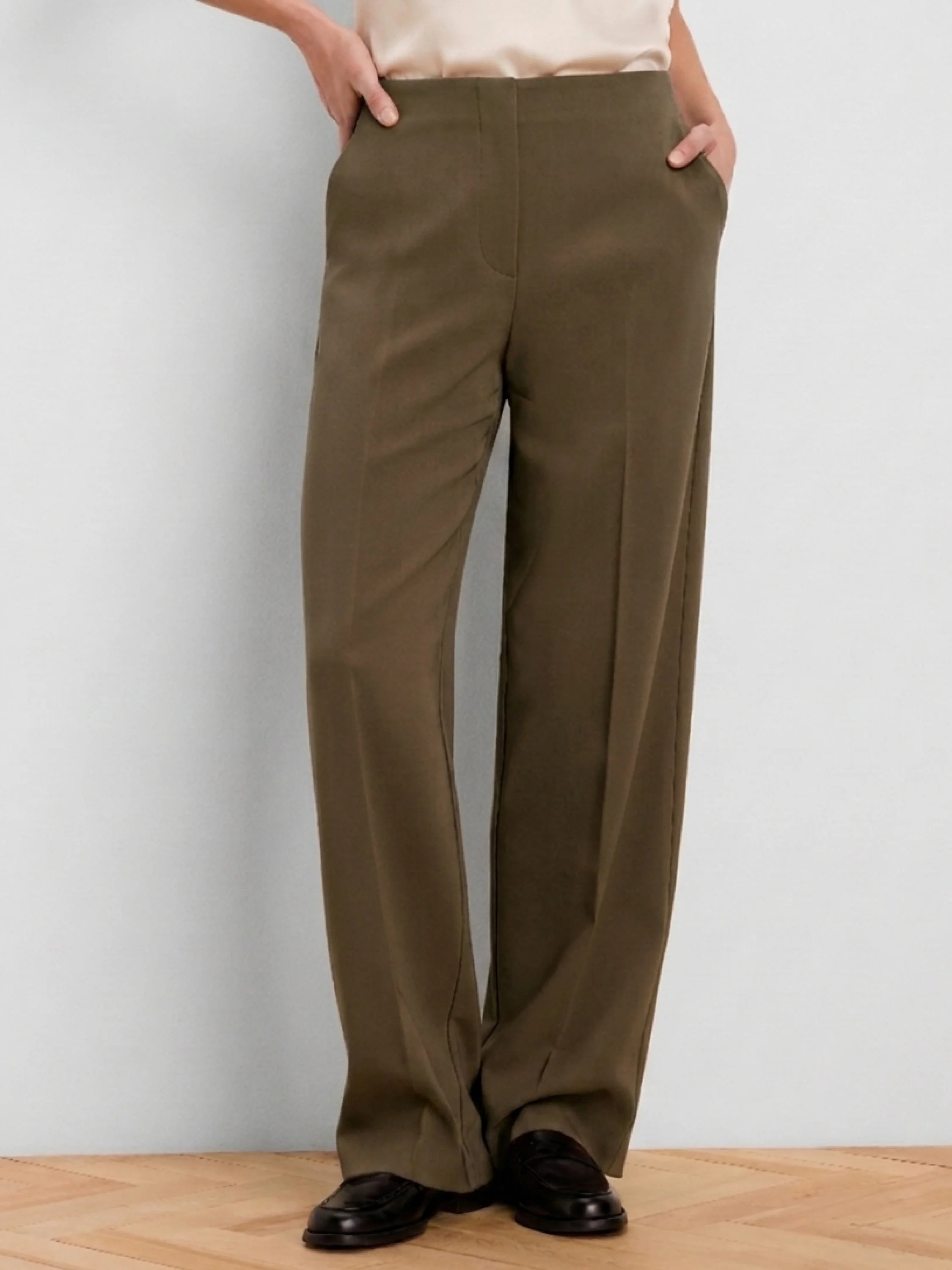 Olive wide-leg pants with a smooth finish, high waist, flat front, and side pockets.