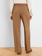 Camel wide-leg pants with smooth fabric, back view. Center back and leg seams visible.