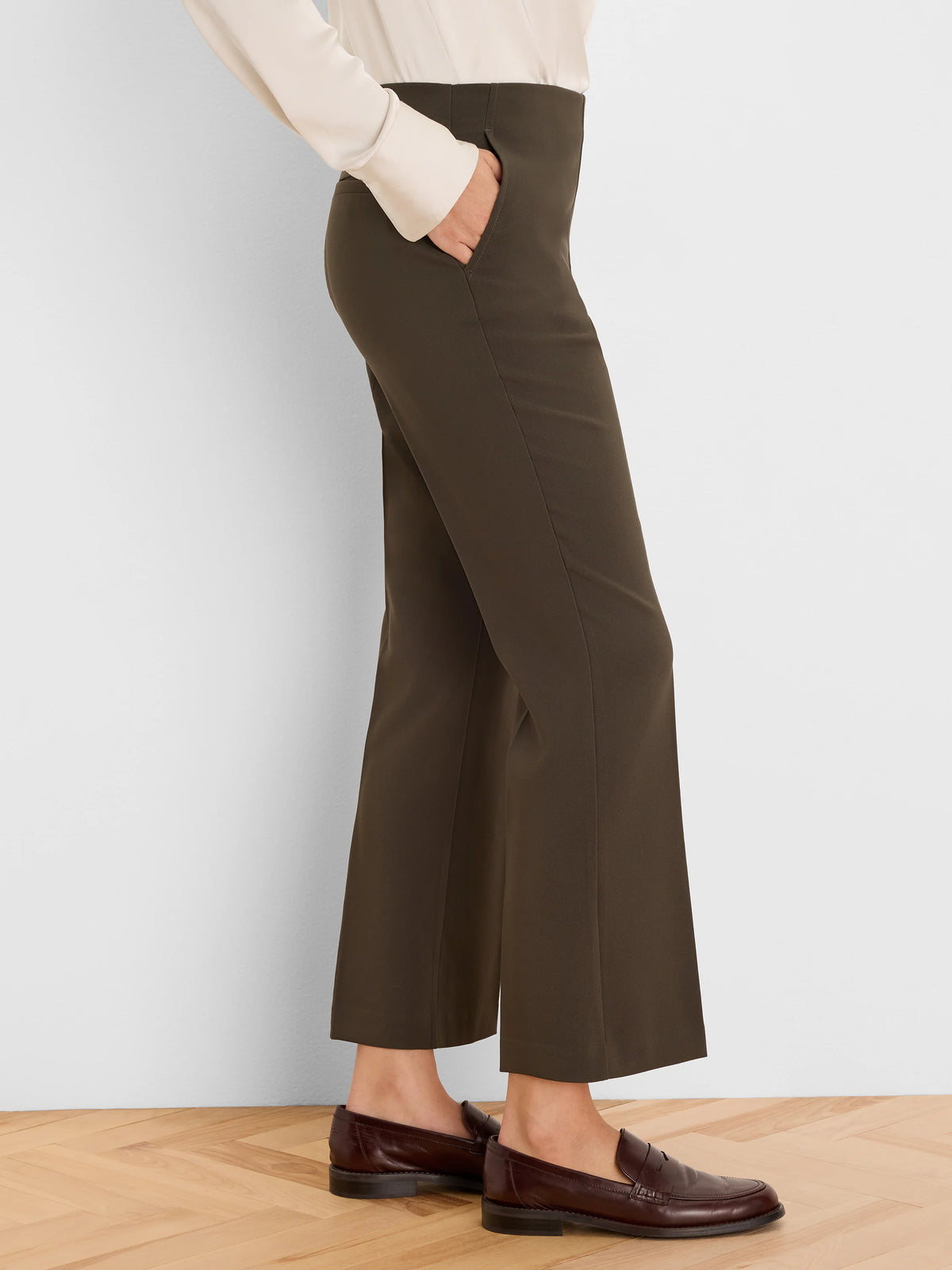 Dark olive high-waisted demi bootcut ankle pants with slash pockets.