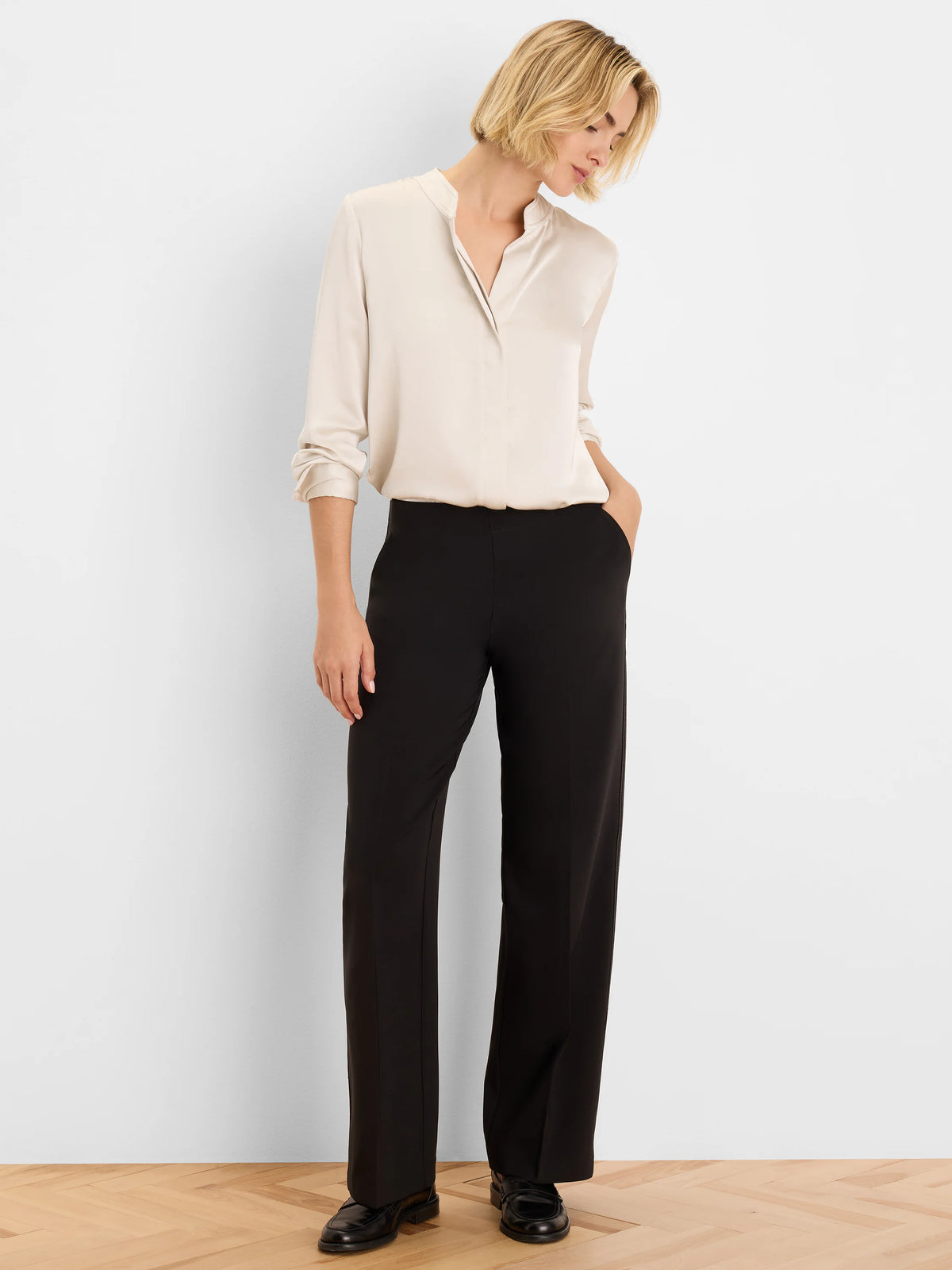 Black wide-leg pants with an accent stitch detail on the side.