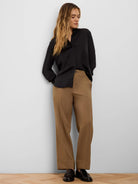 Glossy black long-sleeve shirt with an open band collar and relaxed fit.