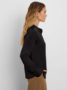 Black long-sleeved collared shirt with a glossy finish.