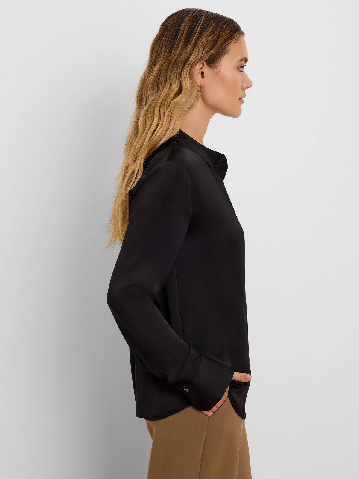 Black long-sleeved collared shirt with a glossy finish.