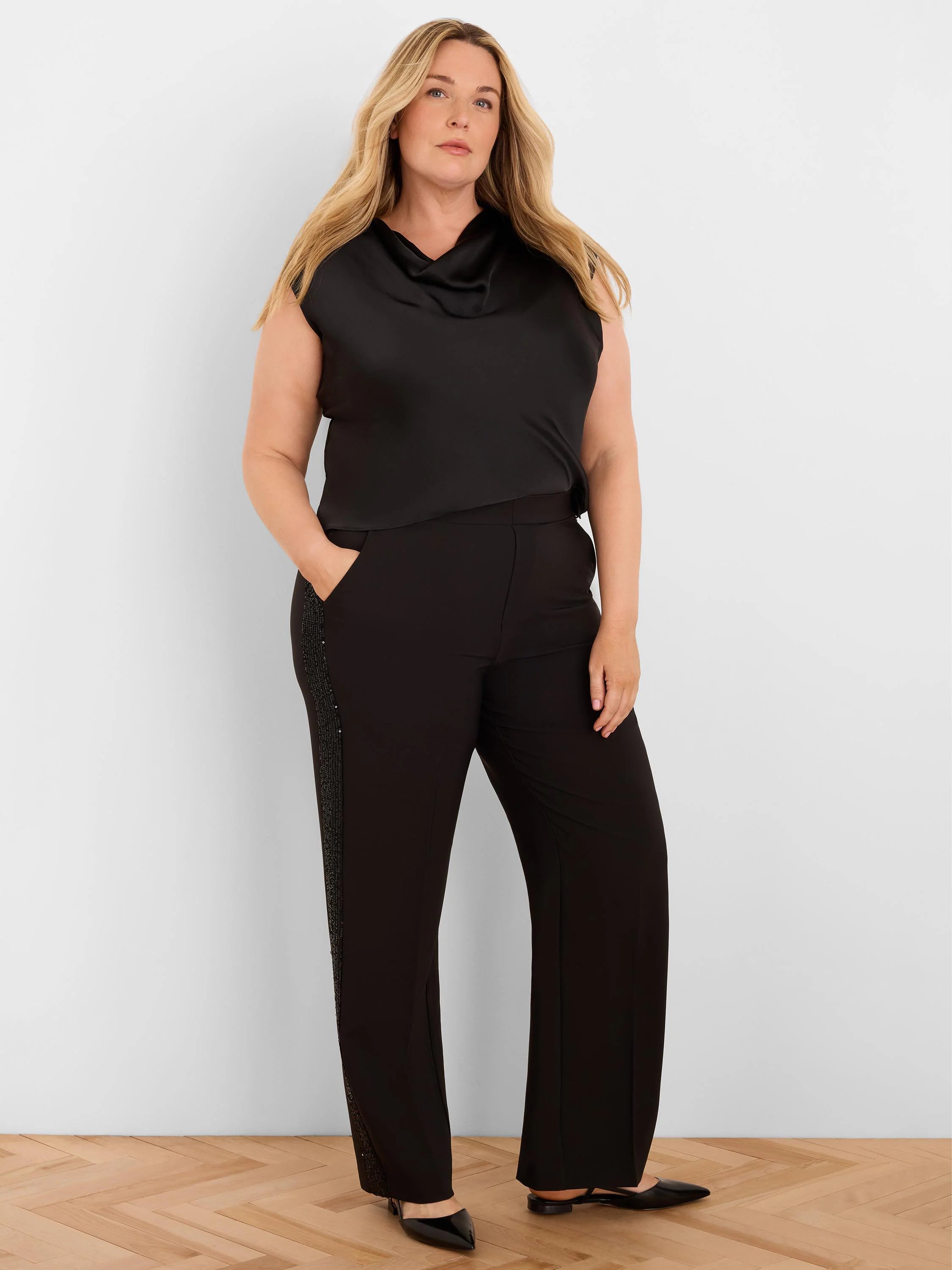 Black sleeveless drape neck top with a subtle glossy finish.