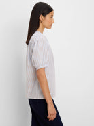 Light blue shirt with thin white & reddish-brown vertical stripes. Short, gathered sleeves.