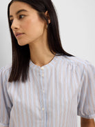 Light blue Eton Stripe Shirt with thin vertical pink and dark brown stripes, band collar, and short gathered sleeves.