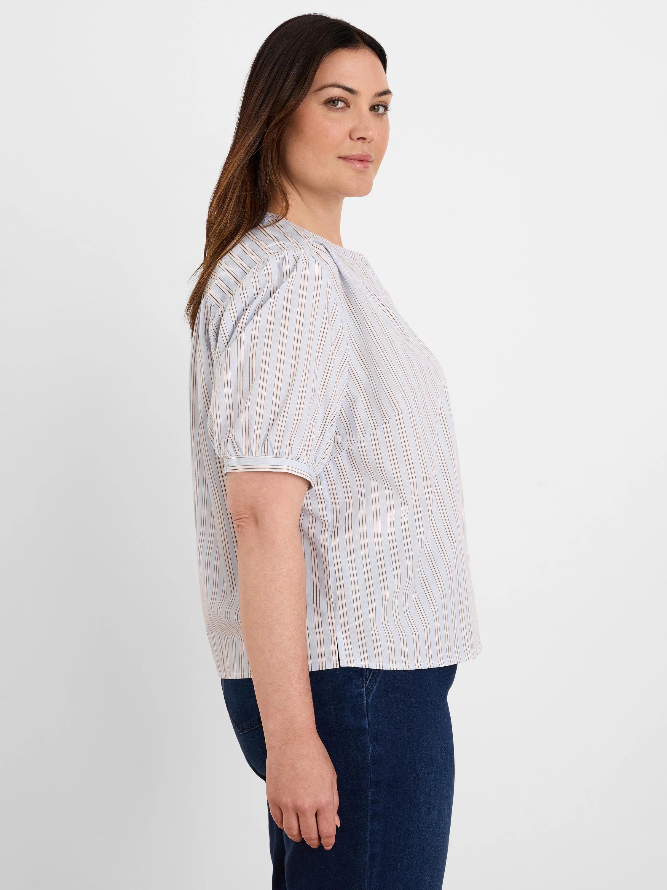 Light blue shirt with thin white & brown vertical stripes. Has short puffed sleeves & a round neck.