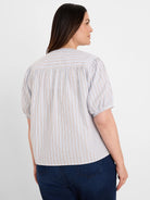 Light blue shirt with thin white & tan vertical stripes. Features short gathered sleeves & pleated back yoke.