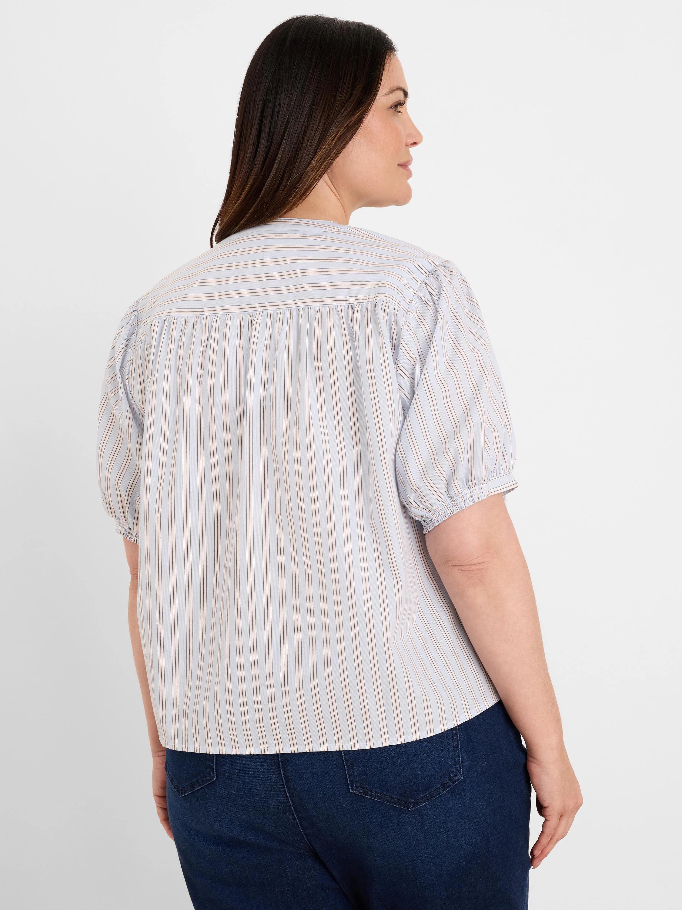 Light blue shirt with thin white & tan vertical stripes. Features short gathered sleeves & pleated back yoke.