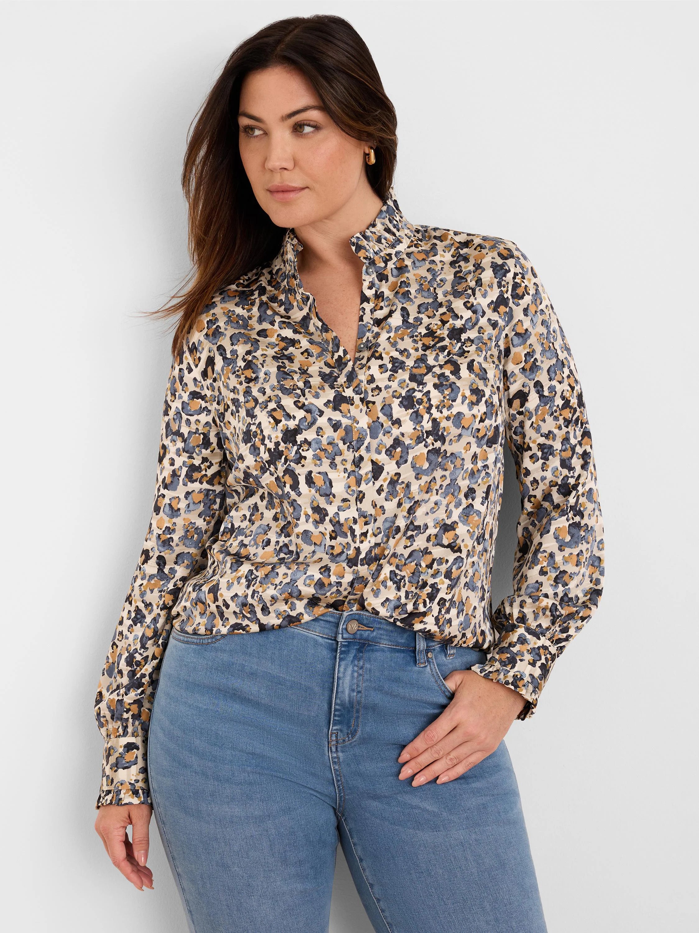 Cream shirt with abstract blue, gold, and black 'flake' pattern. Features a ruffled stand collar, V-neck, and ruffled cuffs.