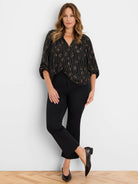 Shiny copper-rose stripes & diamond pattern on a black shirt, V-neck, with 3/4 gathered sleeves.