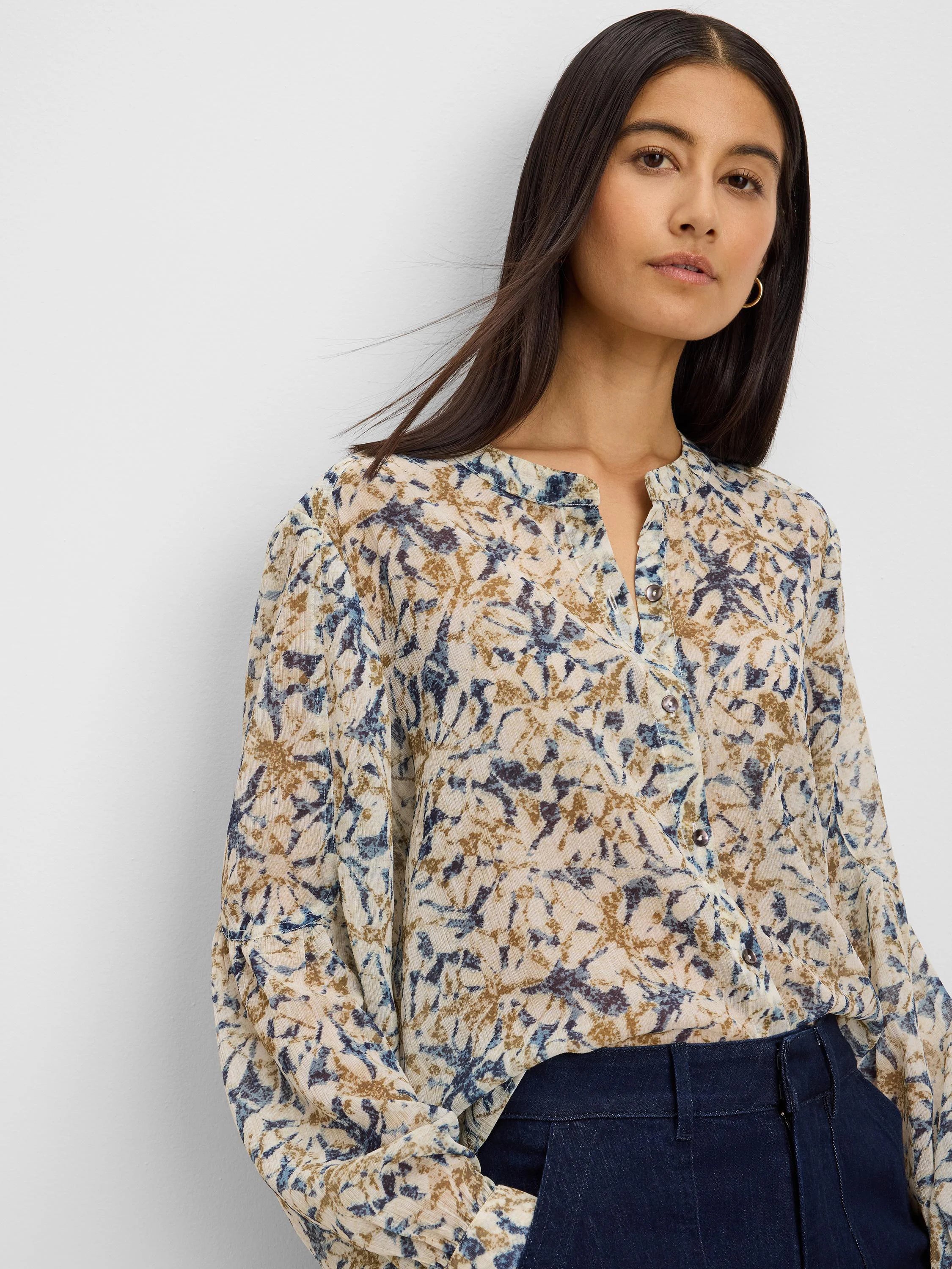 Cream chiffon shirt with abstract navy and golden brown print, long sleeves, and a band collar.