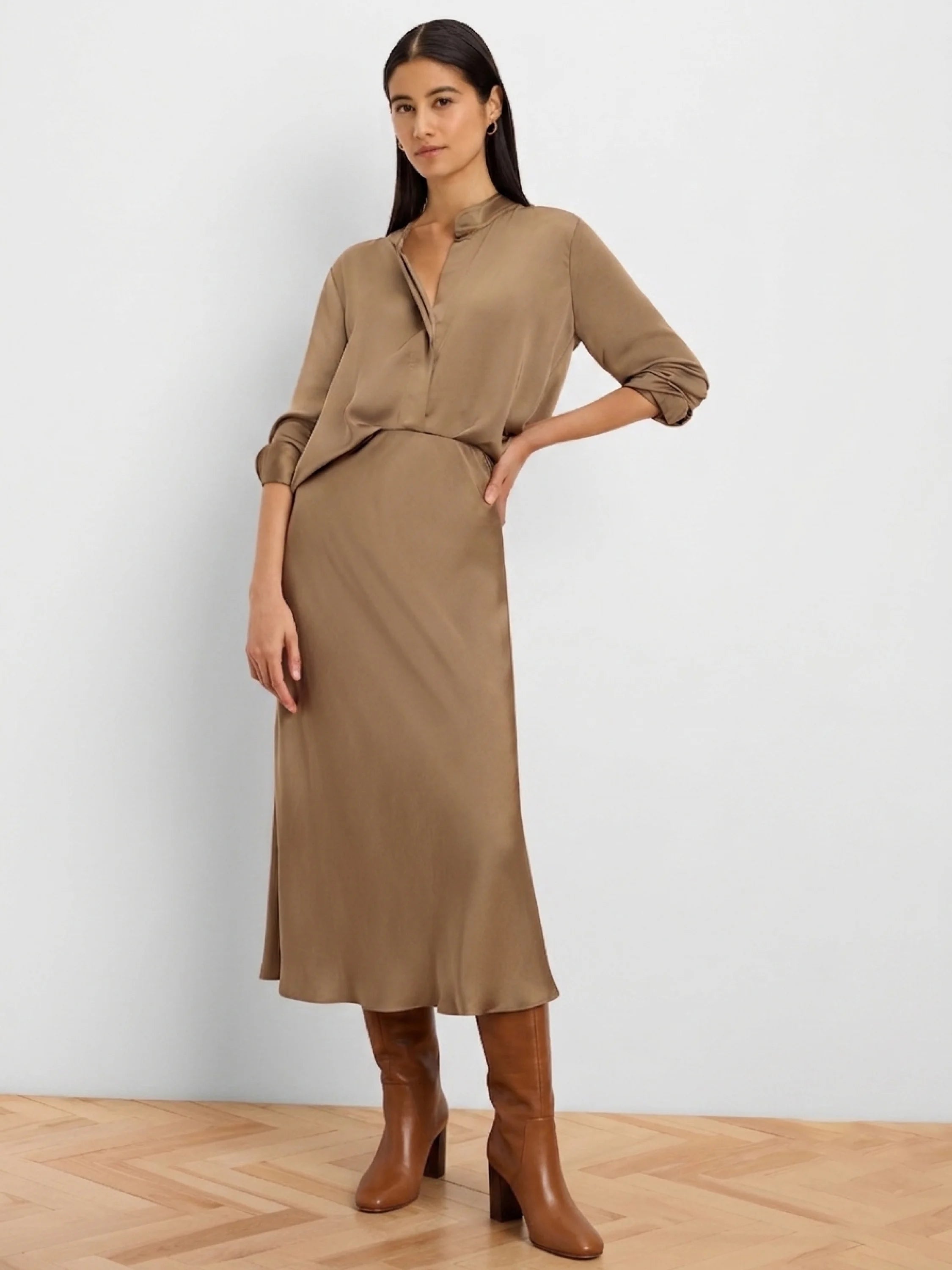Warm brown glossy midi-length slip skirt.