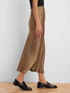 Long, flowing bronze-brown slip skirt with a shiny, satin finish.