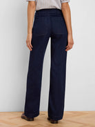Dark blue wide leg jeans, shown from back, with two rectangular patch pockets on the rear.