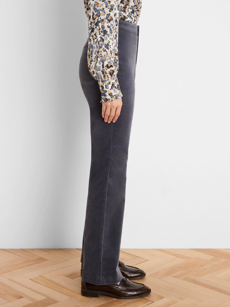 Dark grey velvet high-rise bootcut pants, shown from the side on a model.