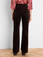 Dark brown velvet high-rise boot-cut pants, back view with two pockets.