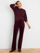 Deep burgundy velvet pants, high rise, with a subtle boot cut.