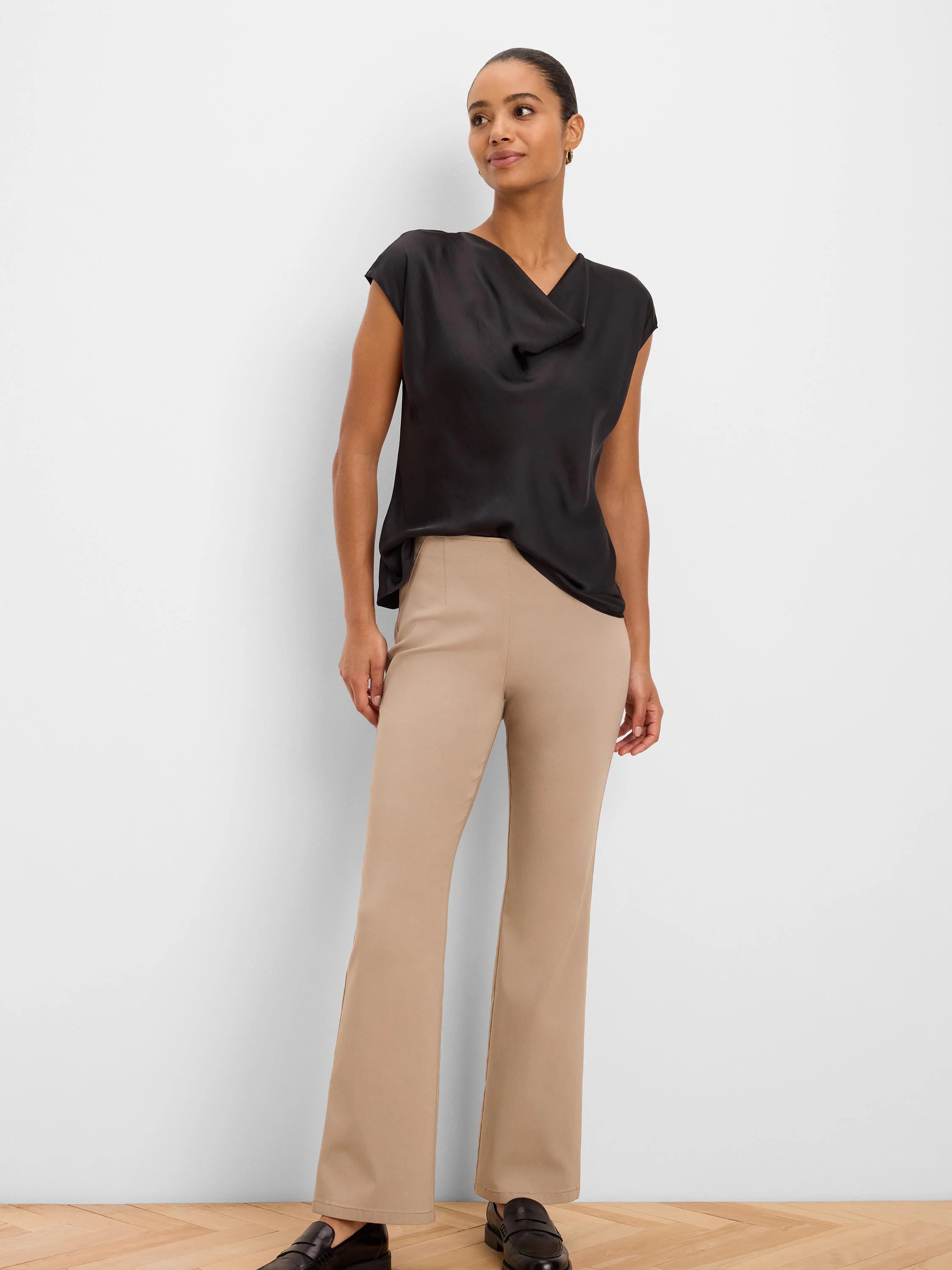 Tan, full-length, boot-cut Wonderstretch pants on a model.