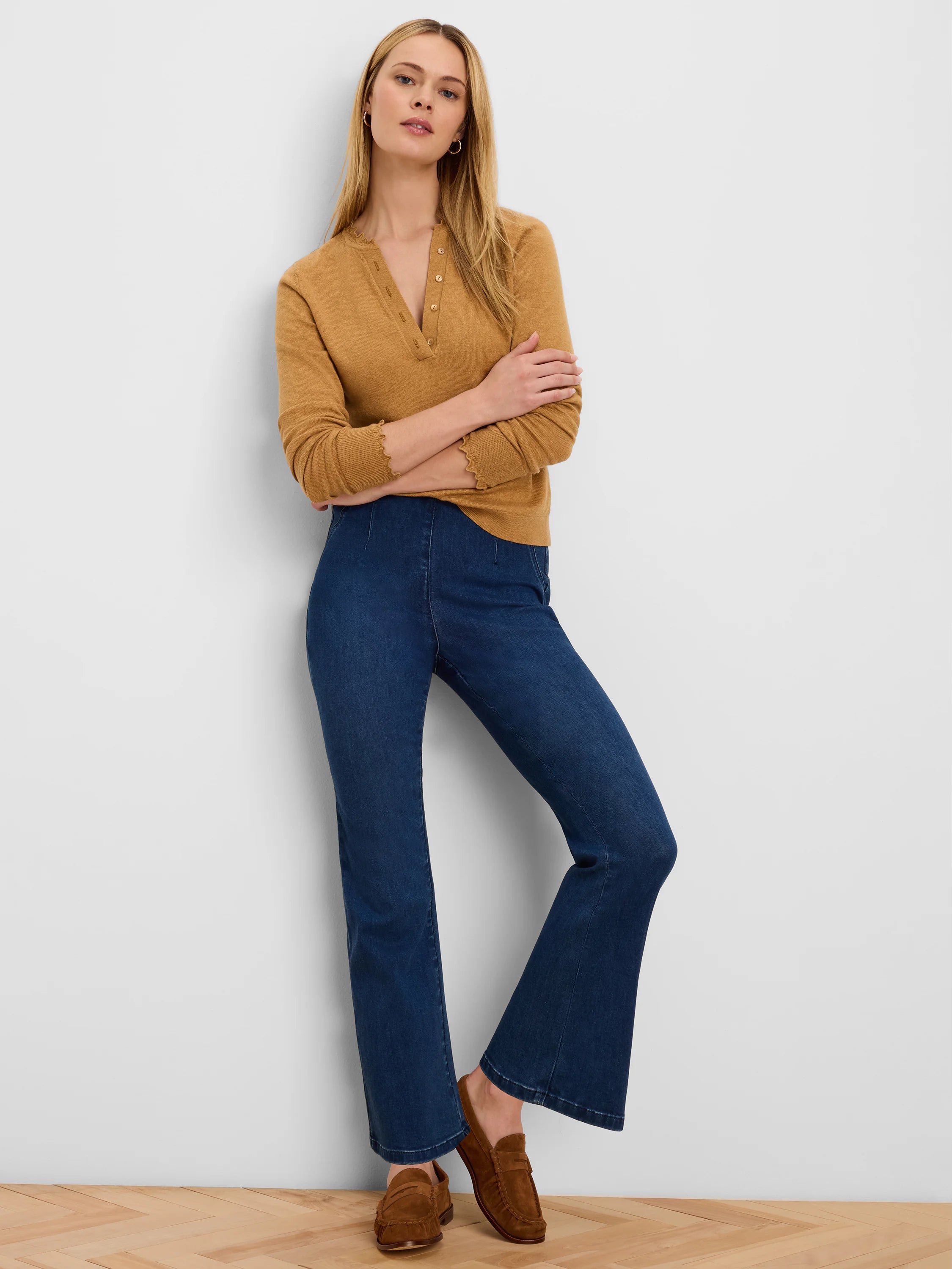 High-waisted, dark indigo bootcut jeans with a front seam.