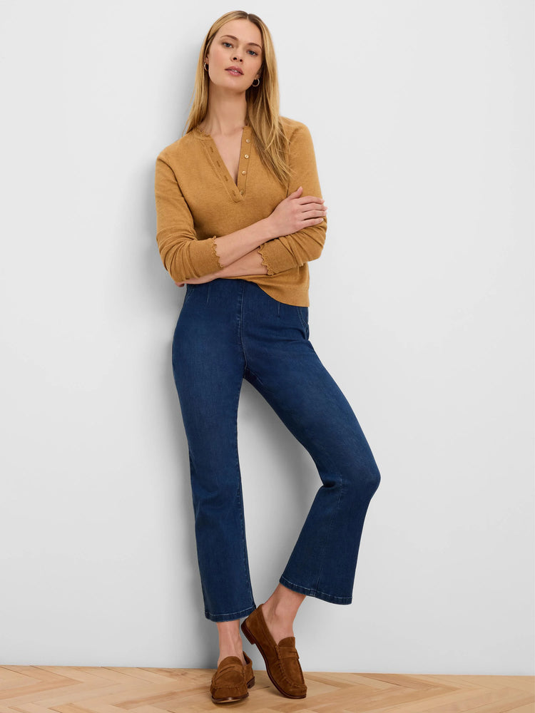 Dark blue bootcut jeans with a cropped leg.