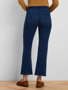 Dark blue cropped bootcut jeans with back patch pockets.