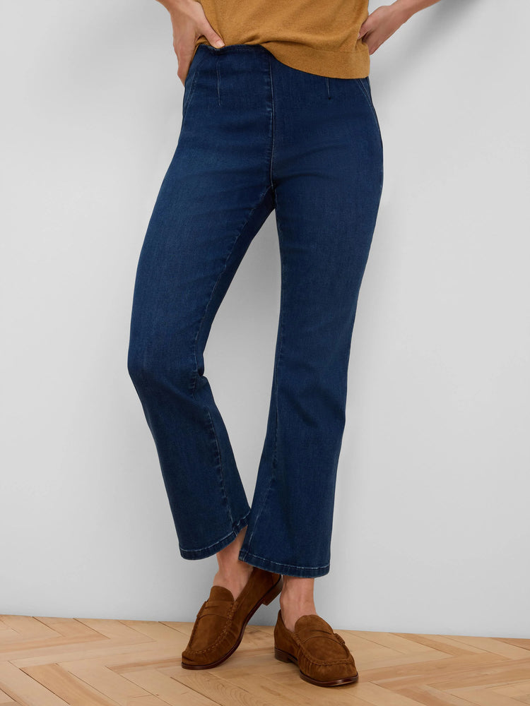 Dark blue ankle-length bootcut jeans with a smooth flat front.