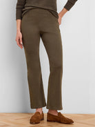 Dark olive green pull-on bootcut jeans with a smooth front, visible vertical leg seams, and a slight flare at the ankle.