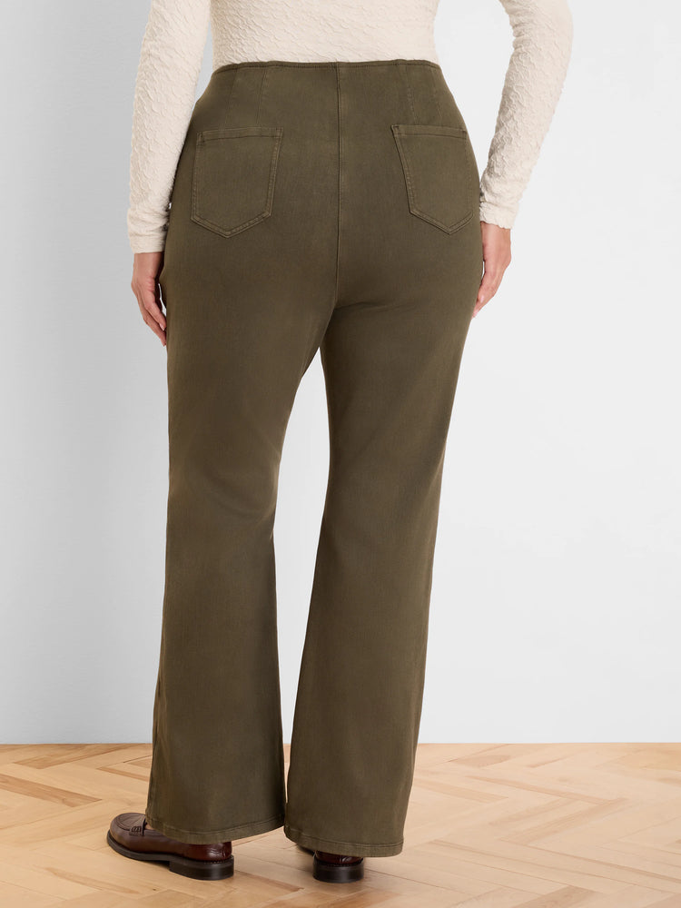 Dark olive high-waisted bootcut jeans with back patch pockets, worn by a model, seen from behind.