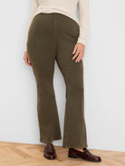 Olive bootcut jeans. High-waisted, slim through the thigh with a subtle flare.