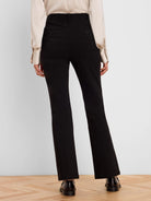 Black high-rise bootcut pants shown from the back, with small buttoned back pockets.