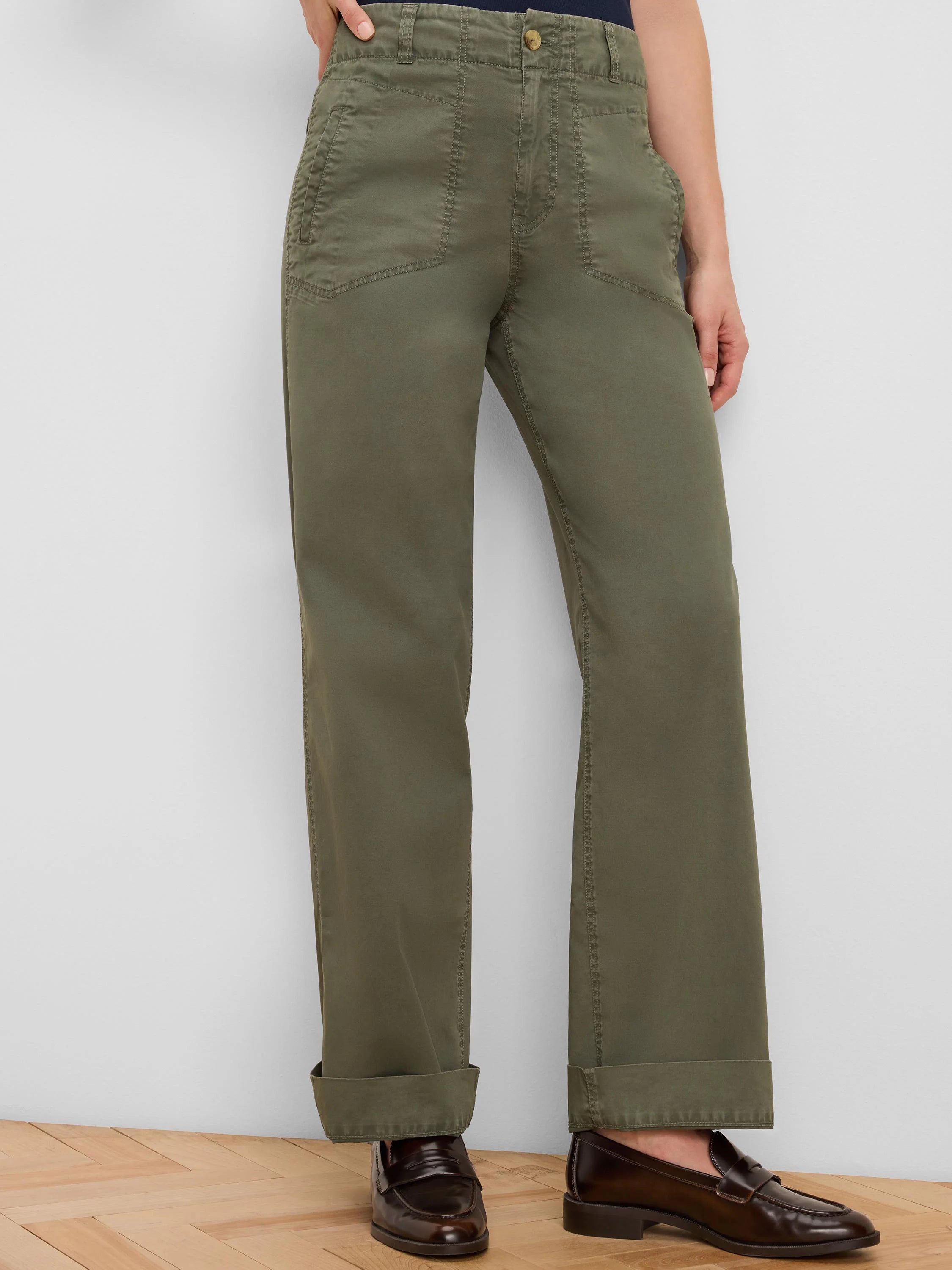 Olive green relaxed fit pants with angled patch pockets, button, and cuffed hem.