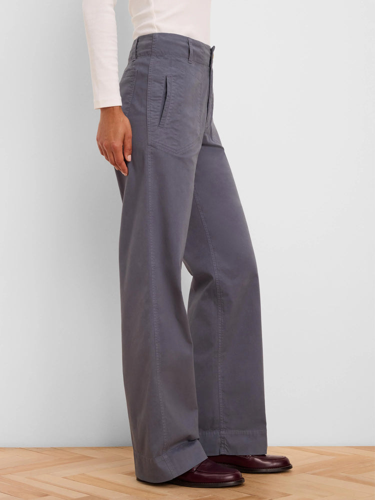 Dark grey wide-leg pants featuring angled front pockets and vertical seams.