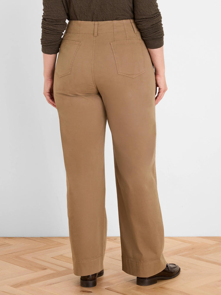 Rear view of tan high-waist pants with belt loops, two patch back pockets, and straight legs.