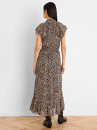 Black georgette maxi dress, cream/pink abstract animal print. Ruffled collar, cap sleeves, elastic waist.