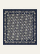 Navy blue scarf with an off-white floral pattern and border.