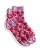 Lavender knitted socks with red heart pattern.