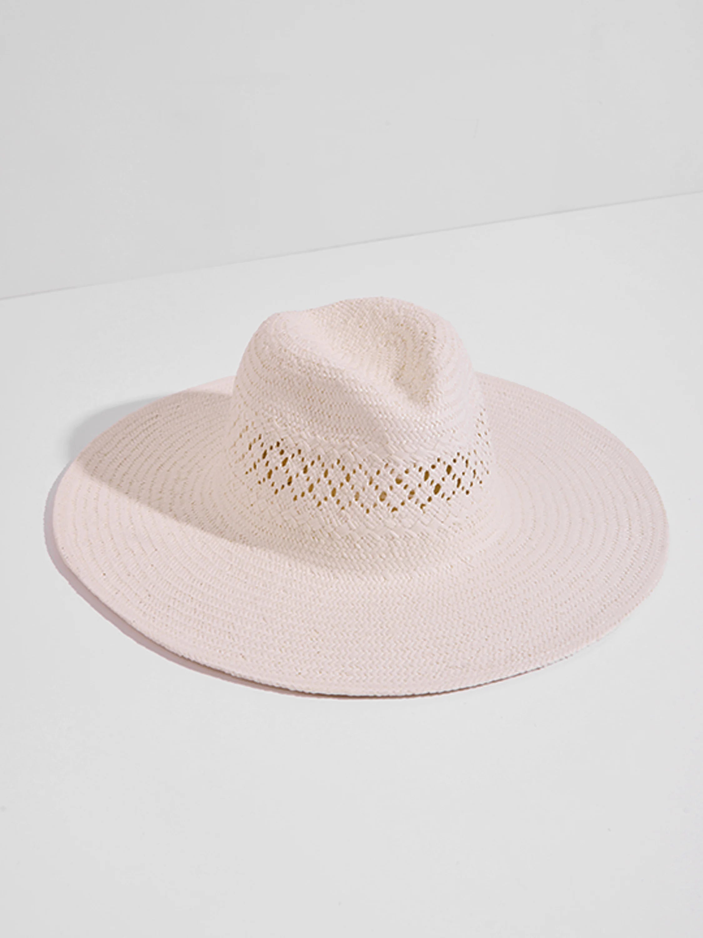 Off-white wide-brimmed hat with a band of eyelet detailing.