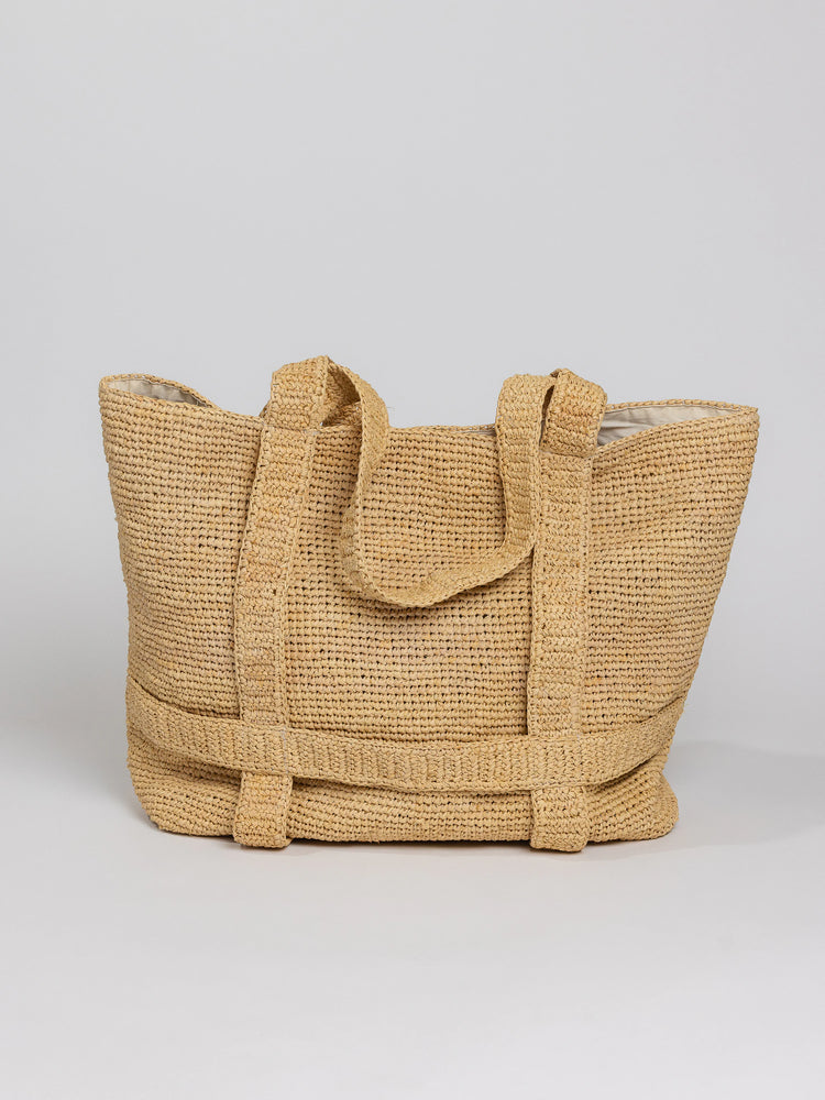Beige crocheted tote bag with light beige interior;  two long handles.