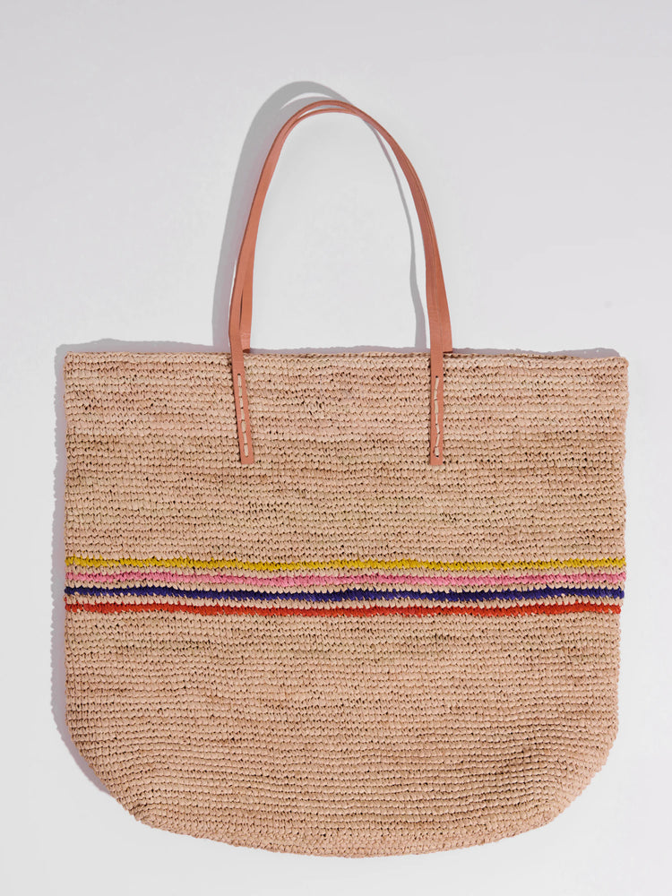 Beige woven tote bag with light orange leather handles and a multicolored stripe detail.