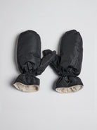 Black mittens with beige lining; shown lying flat.