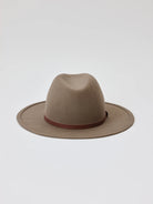 Taupe felt fedora with a brown leather band.