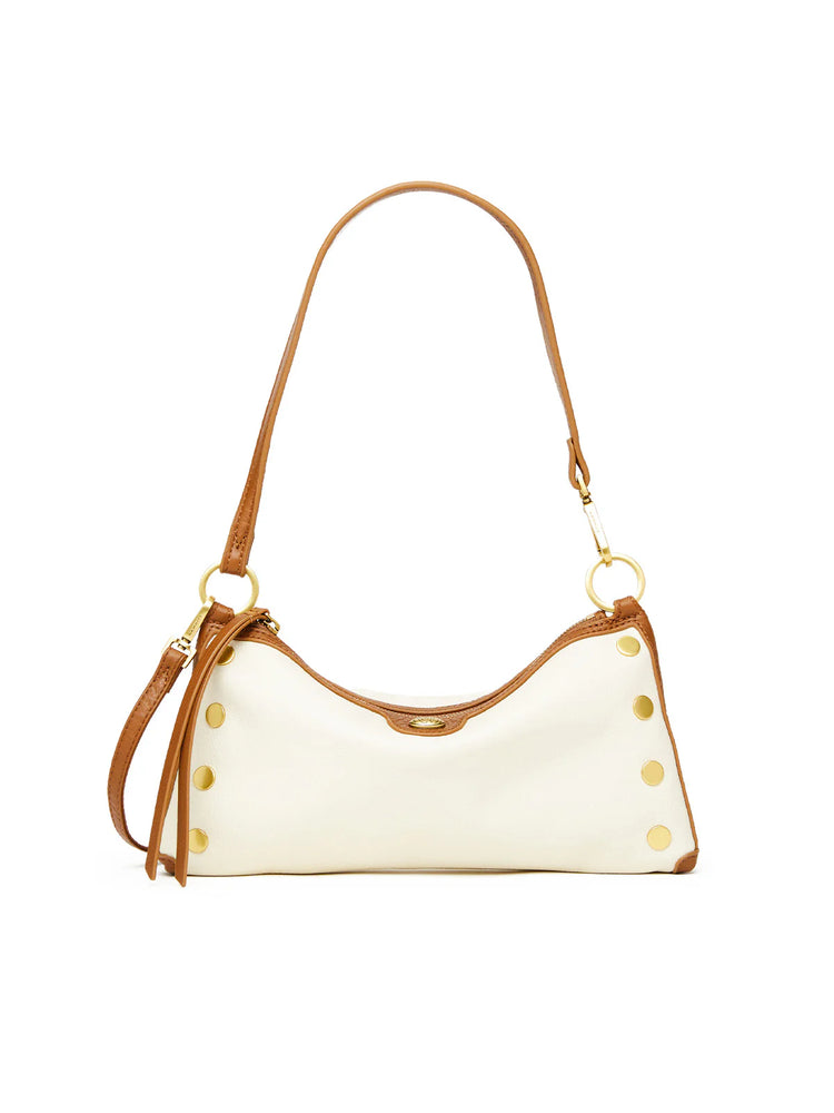 Hammitt Kyle cream baguette bag with tan leather trim, gold studs on sides, and gold-toned hardware.