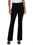 Black bootcut jeans; high-rise waist.