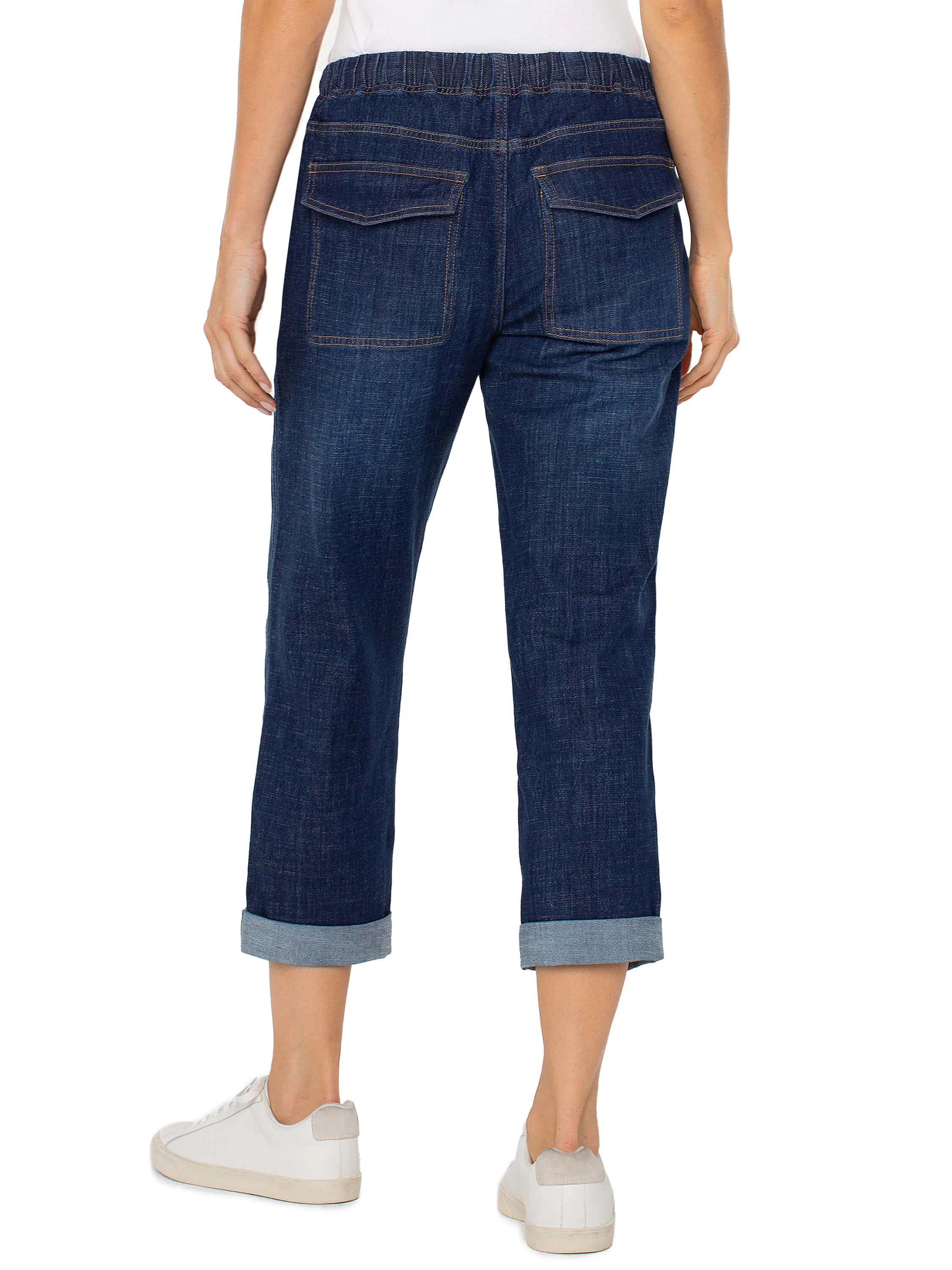 Dark wash denim cropped jeans, cuffed hems.  Two back pockets. Elastic waistband.
