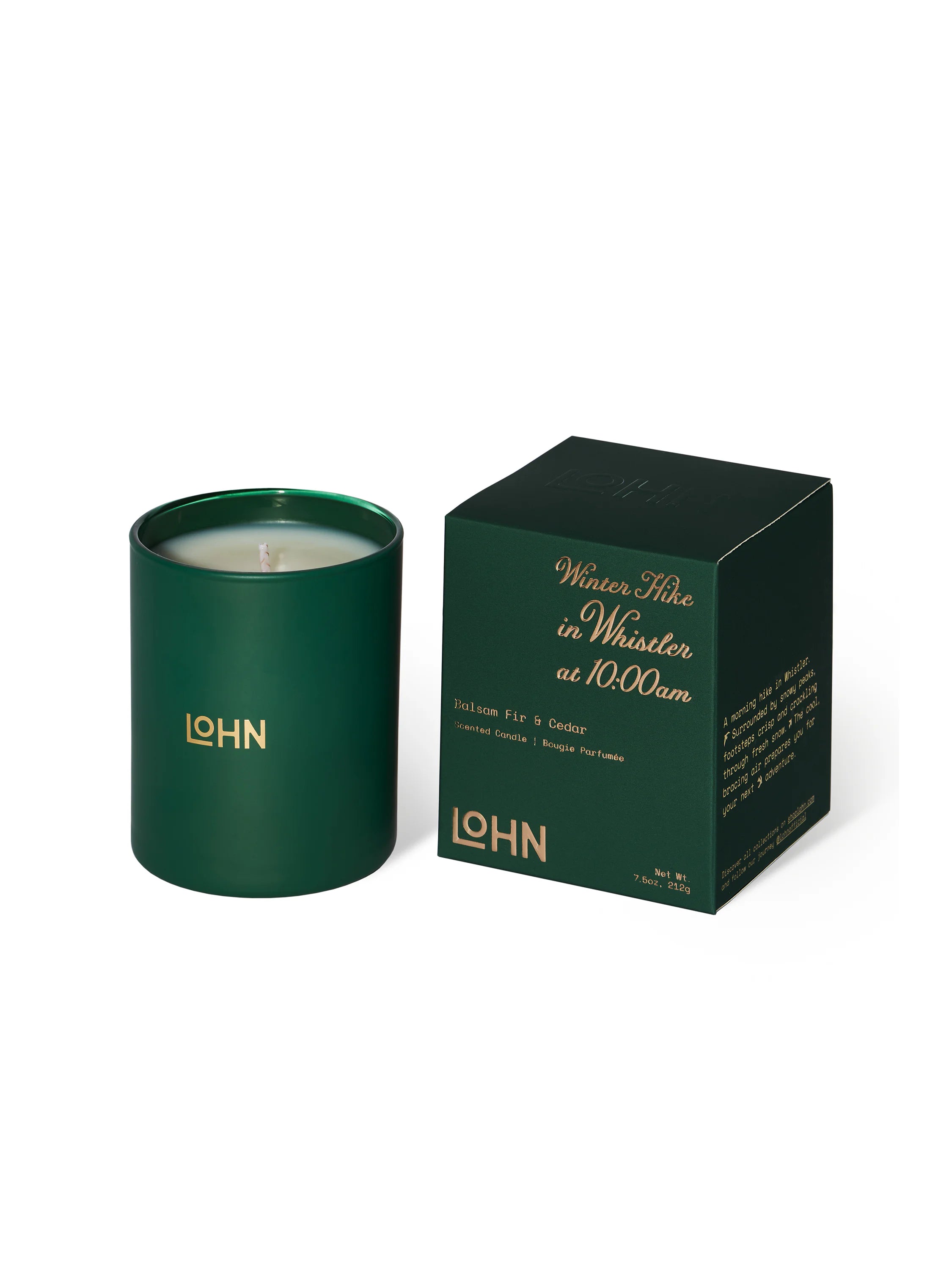 Dark green candle in matching box; off-white wax; gold logo.