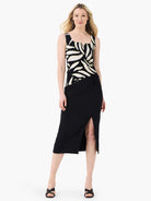 Black tank with square split neck. Features abstract cream and pale yellow leaf pattern.